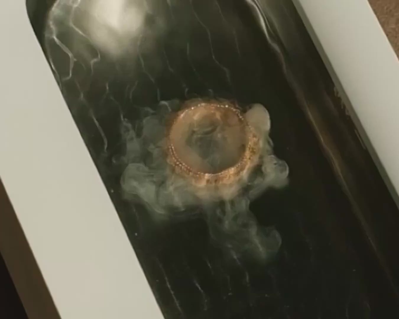 akua sonic ultrasonic jewelry cleaner dust cloud tarnish contamination gold ring intricate detail
